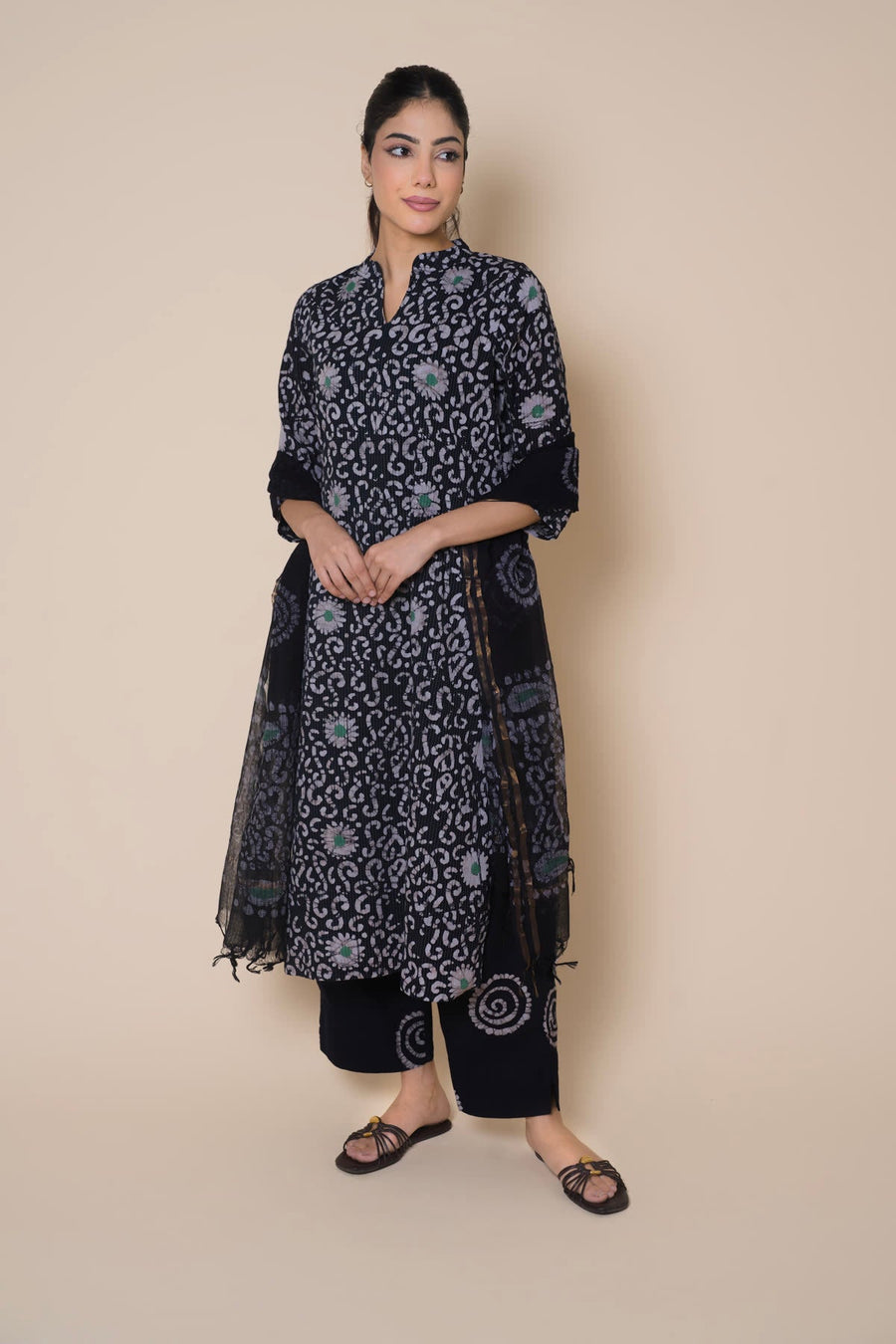 Woman in a navy block print kurta set with a dark dupatta